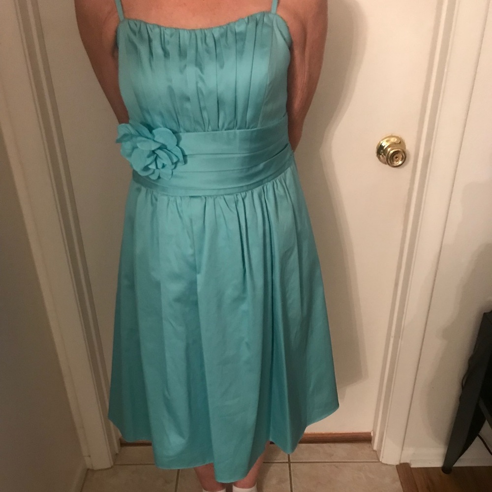 Tea length bridesmaid dress with straps.